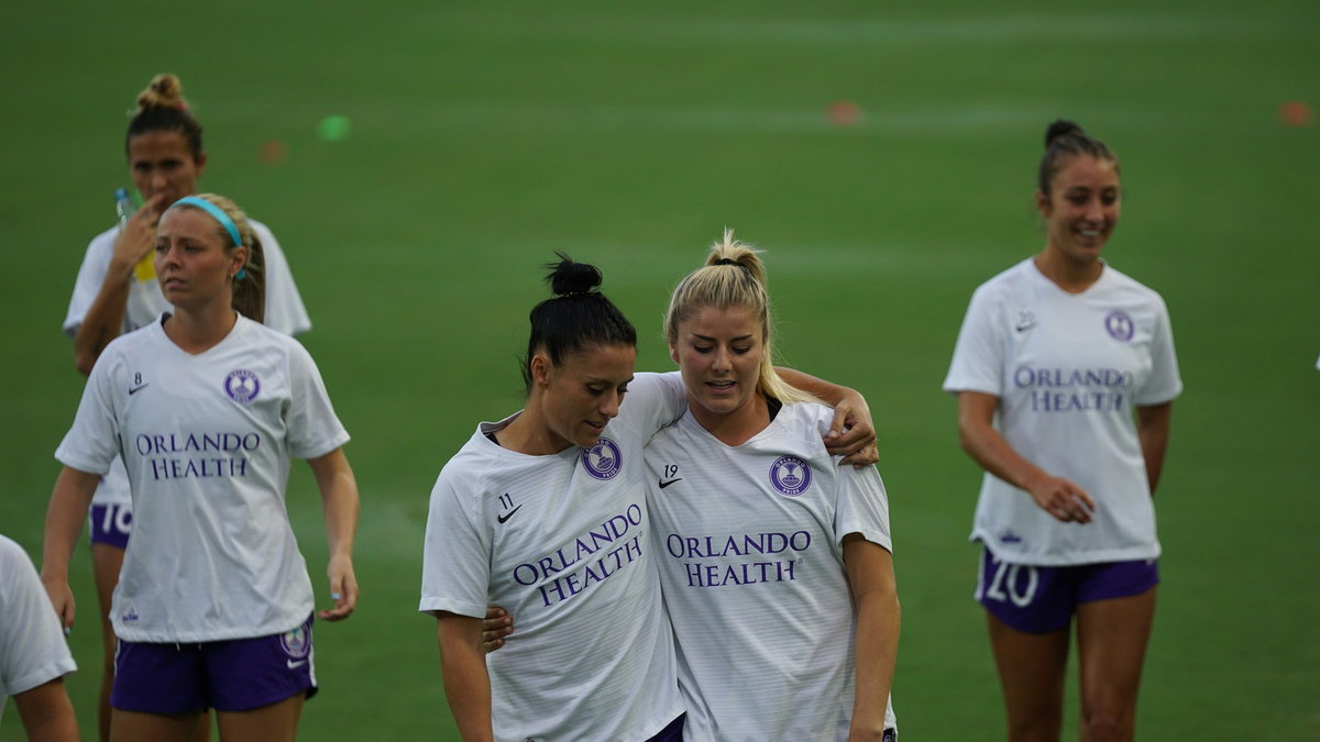 Girls soccer players walking together at a tournament