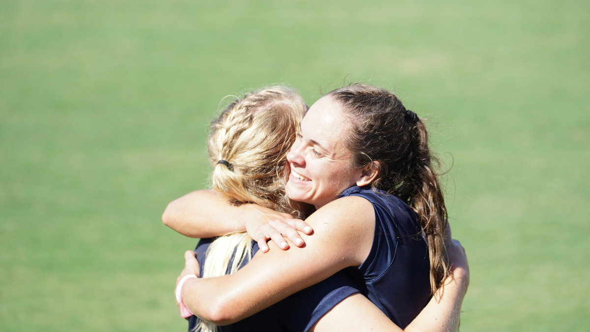 Two athletes sharing support after competition