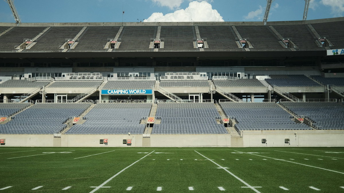 Empty stadium seats overlooking a football field