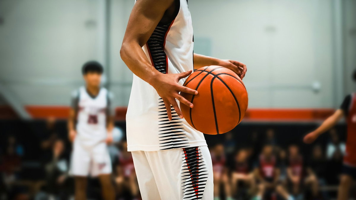 Basketball player holding the ball during a game