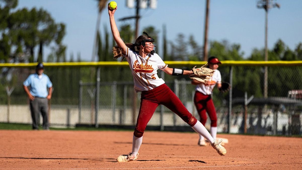 Softball pitcher focused before a pitch