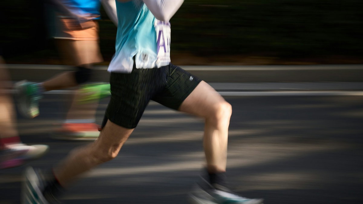 Runners moving fast in a race with motion blur