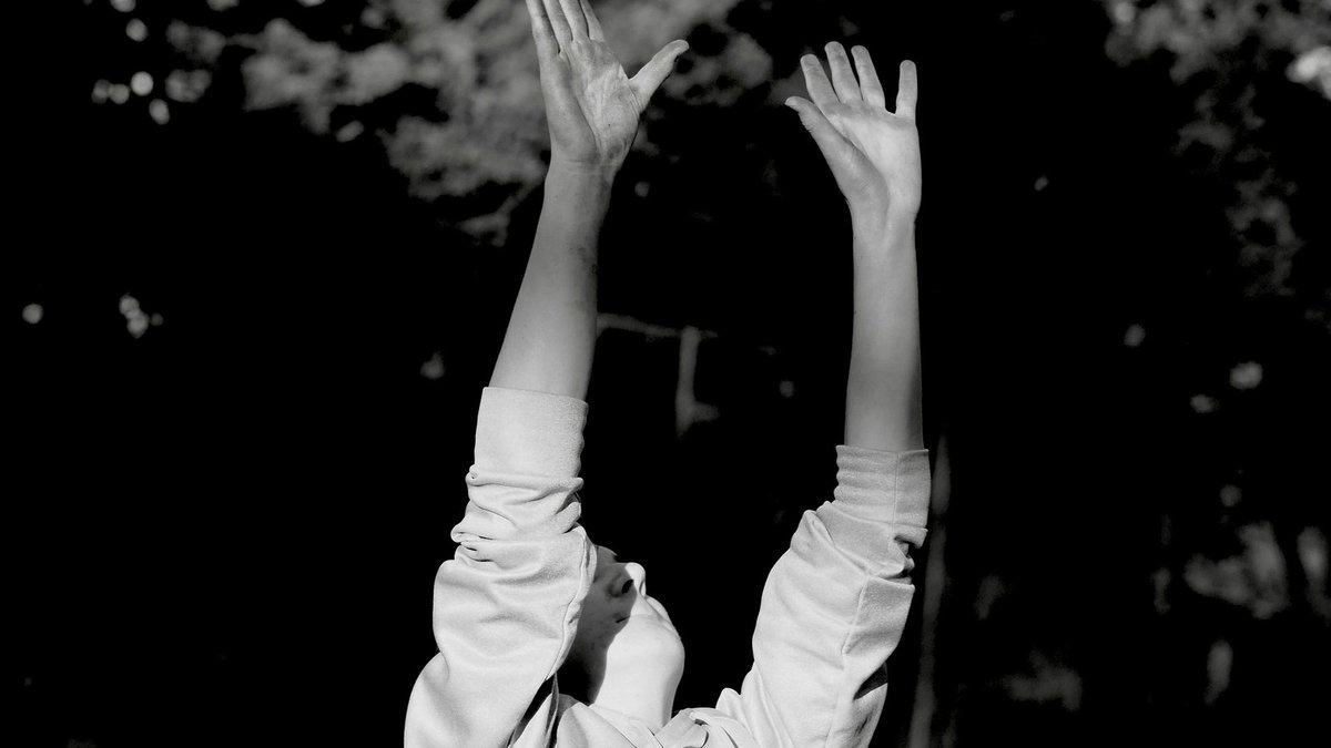 Athlete reaching for a volleyball outdoors