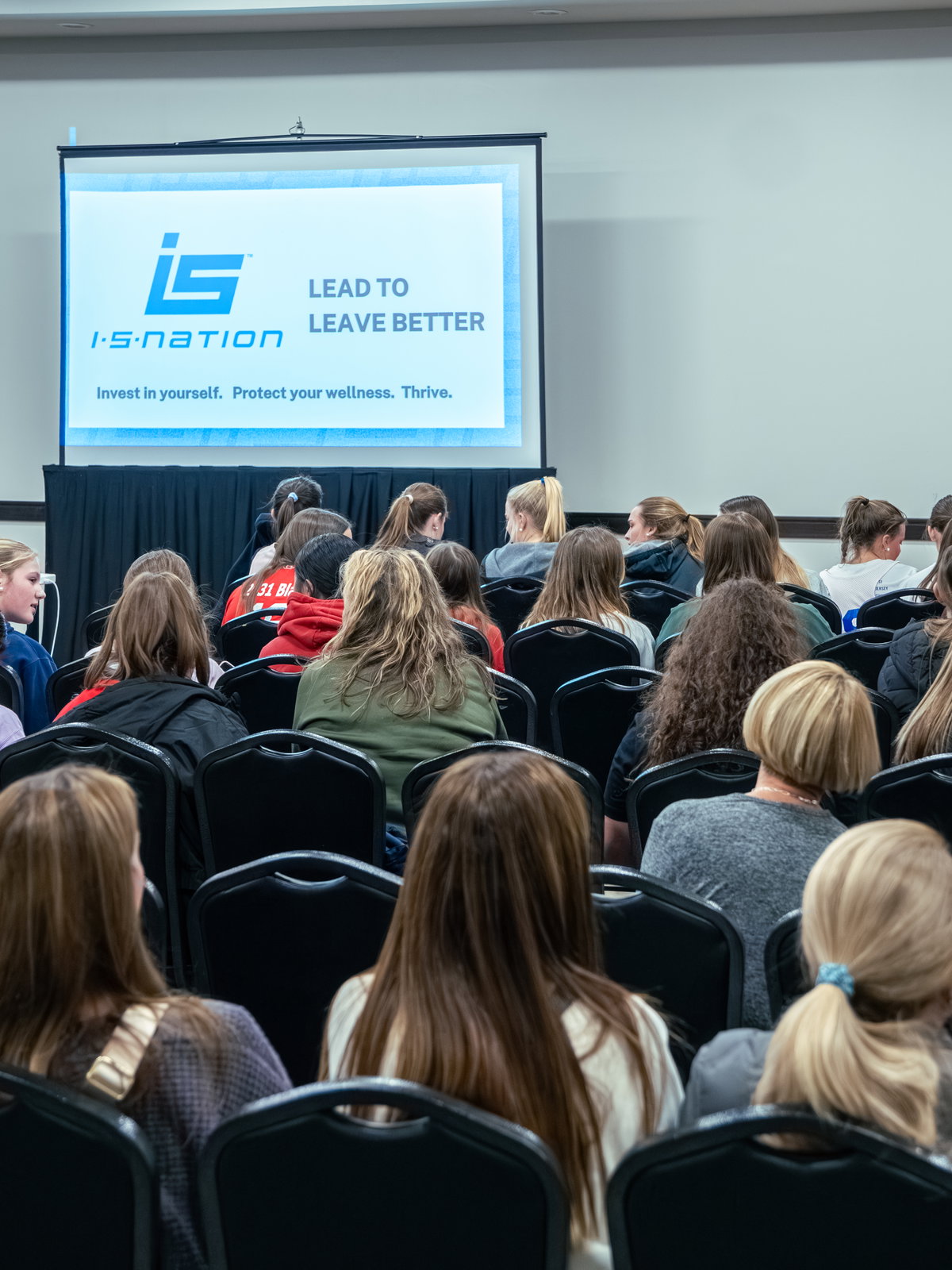 Tracey Currey connecting with young athletes at an ISNation event